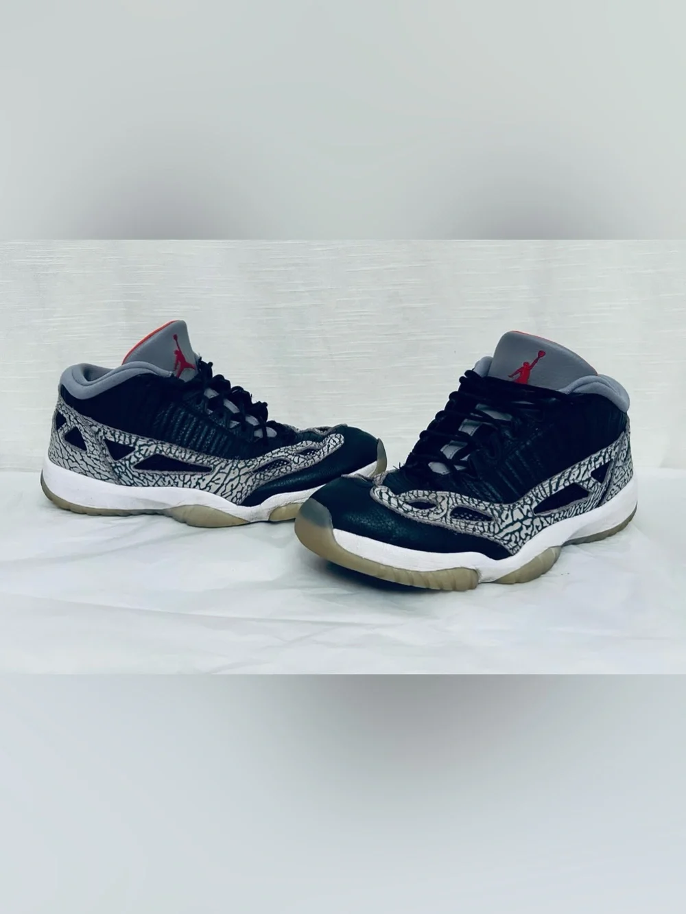 Air Jordan 11 Retro Low IE‎ Men's Black/Grey Sneakers with Red Jumpman Accents